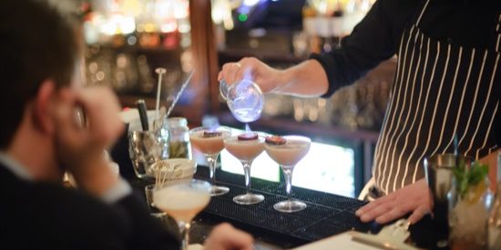 Cocktail serve at your bar bar tender pouring cocktails