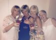 4 women with cocktails