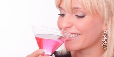 Cocktail drinking blonde Cosmopolitan demonstration