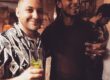 2 young men drinking cocktails